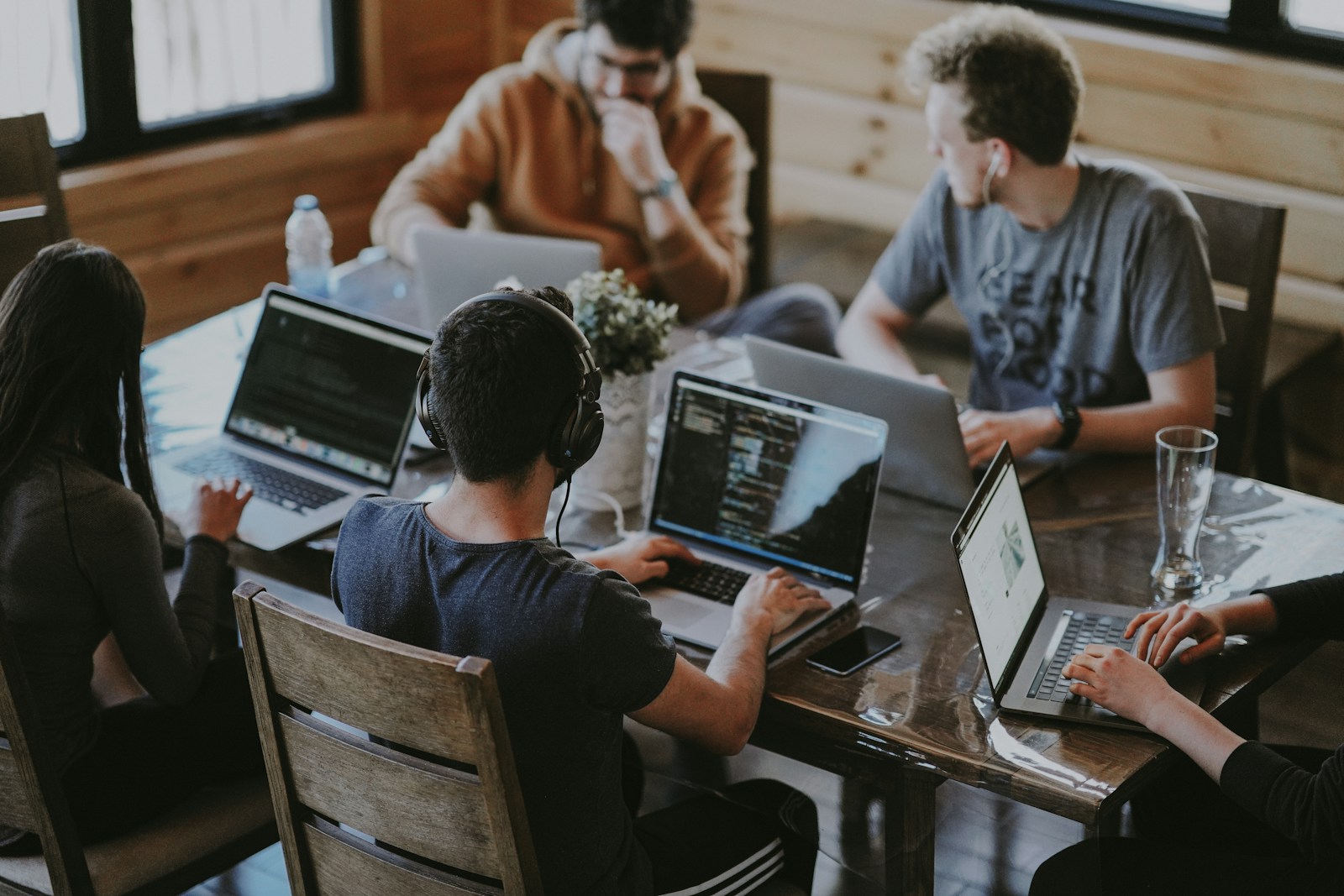 Editorial team discussing startup profile feature assignments